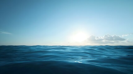 Fototapeta premium Ocean waves under a bright sky with a few clouds near the horizon.