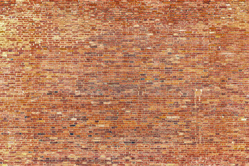 vintage brick wall as a backdrop, red cobblestone masonry texture