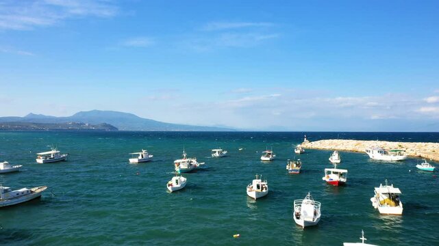 Boats moored in the port of Koroni in Europe, Greece, Peloponnese, Mani, in summer, on a sunny day.&nbsp;