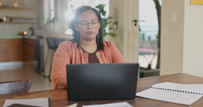 Woman, headache and laptop for work from home stress, confused and doubt with financial mistake or debt. Tired freelancer with burnout, typing on computer and documents for bills, taxes or business