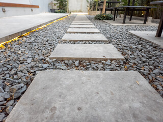 Concrete walkway laid over coral rock