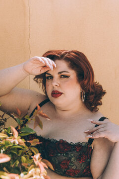 Plus size old Hollywood lingerie model outdoors