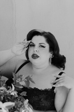 Plus size old Hollywood lingerie model outdoors