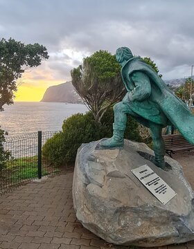 Monument to Joao Gon&ccedil;alves Zarco &ndash; the discoverer of Madeira, the founder of Funchal in 1508, looking out into the waters of the Atlantic during the sunset