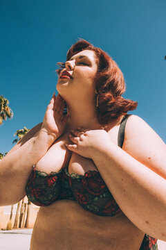 Plus size old Hollywood lingerie model outdoors