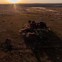 Owyhee Desert at sunrise with stone building ruin