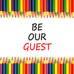 Be our guest symbol. Concept words Be our guest on beautiful white paper. Beautiful white paper background. Colored pencils. Business and be our guest concept. Copy space.