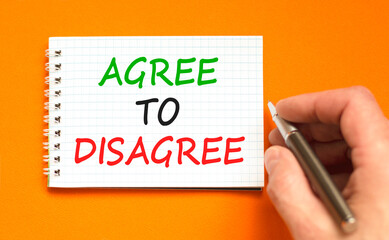 Agree to disagree symbol. Concept words Agree to disagree on beautiful white note. Beautiful orange...