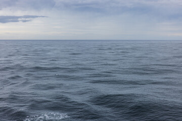 Open ocean on the horizon on stormy overcasts day 