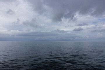 Fototapeta premium Beautiful peaceful Atlantic Ocean with gloomy cloudscape still waters