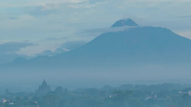  February 5, 2025. 4k timelapse, morning atmosphere in Prambanan area with Sojiwan temple and Mount Merapi in the background.