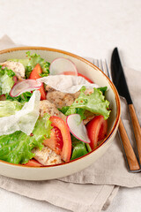 Portion of fresh vegetables salad with chicken