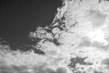 Black and white cloudscape sun blowing out flat like stratocumulus clouds background texture
