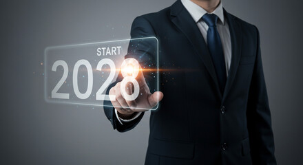 A businessman confidently initiates the year 2028, pressing a futuristic glowing button; a sleek, modern digital interface.