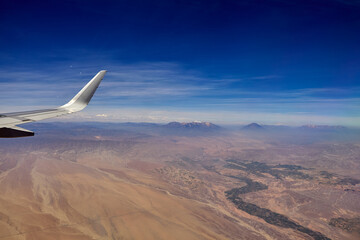 Moments before landing in Arequipa, the window reveals a surreal world—volcanic peaks, craters,...