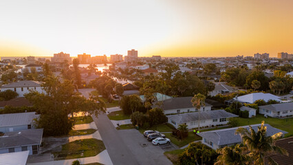 Obraz premium Sunset aerial showing residential neighborhood in Naples Florida