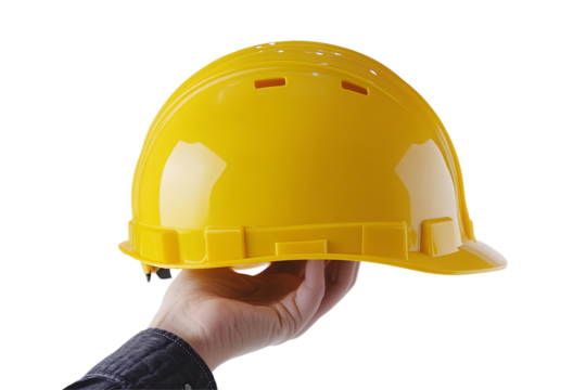 Hand holding a bright yellow hard hat, safety equipment for construction. Protection against head injuries