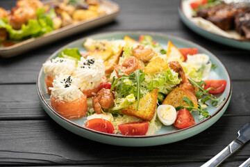 Seafood Caesar salad with shrimp closeup