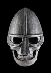 Human skull with medieval norman knight helmet isolated on black background