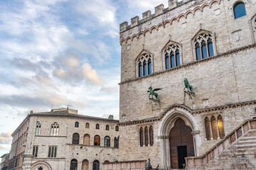 View of Piazza IV Novembre with Palazzo dei Priori and the iconic Fontana Maggiore, landmark symbols of medieval architecture in Umbria.