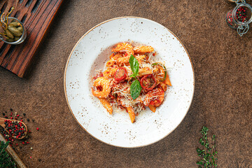 Portion of shrimp penne pasta with mexican sauce