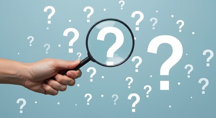 Symbolic representation of inquiry and the pursuit of knowledge through a magnifying glass highlighting a central question mark.