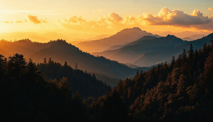 Obraz premium Majestic mountain landscape at sunset with golden light and silhouetted trees in the foreground