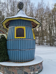 Tiny dwarf village hidden in the forest. Snow covered elf houses. Whimsical travel place.
