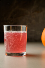 Refreshing bubbly drink garnished with a vibrant orange slice