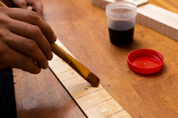 The master tones the guitar cover with strong tea