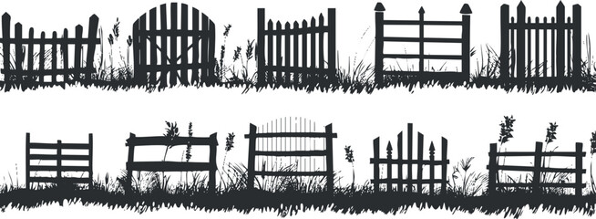 Fototapeta premium Collection of decorative wooden fence silhouettes set against a grassy background.