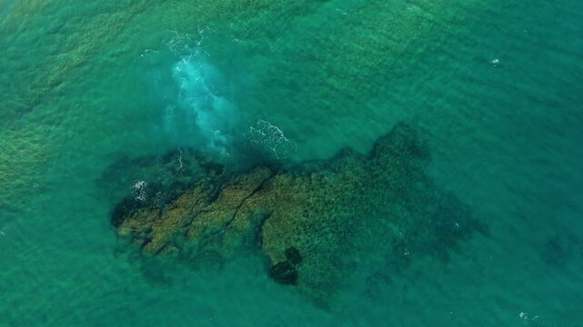 The lonely rock on the shore of the Tyrrhenian Sea in Europe, Italy, Campania, in summer, on a sunny day.&nbsp;