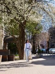 Smiling Woman Relaxing In Cafe With Morning Coffee During Work Break