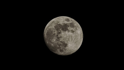 the full moon in close-up with many craters and bright light