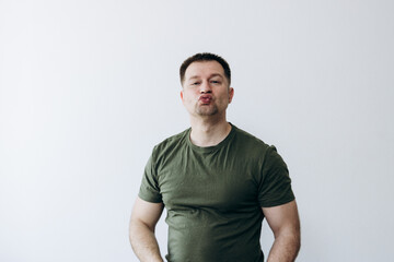 Manly man poses and fools around in front of the camera