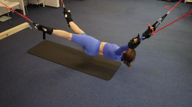 aerial stretch session with joyful expression total body release in suspension soft tension brings weightless freedom balance and pure physical delight
