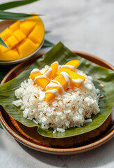 Thai Mango Sticky Rice with Coconut Cream on Banana Leaf