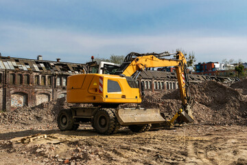 Excavator at work in the Gdansk Stocznia, old shipyard