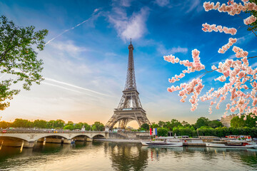 Paris Eiffel Tower and river Seine with sunrise in Paris, France. Eiffel Tower is one of the most iconic landmarks of Paris, web banner format ar early spring morning