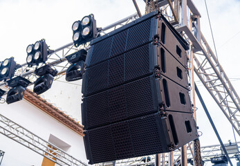 Speakers and lights on a stage.