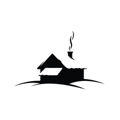 Silhouette Of Cozy Cabin In Winter Snowscape With Smoking Chimney