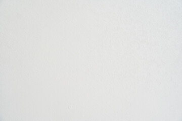 The stone background of the wall with a rough white texture. The abstract, rough and textured surface of the stone material. Overlay for your design with the ability to copy. High quality photo