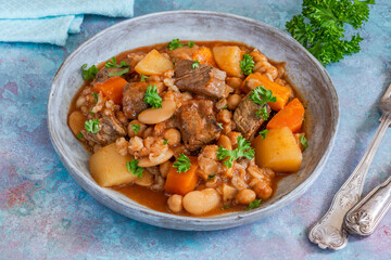 Cholent - traditional slow cooked Jewish stew of beef brisket, butter beans, chickpeas, pearl barley and root vegetables