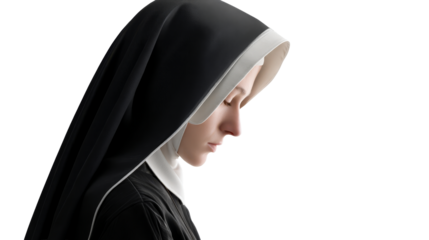 Sister in traditional habit with head bowed in quiet reflection