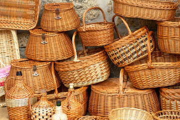 Handmade wicker baskets displayed for sale at a traditional festival in Galicia, Spain