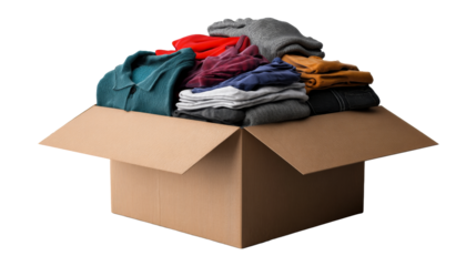 Clothes packed in a cardboard box ready for donation or storage