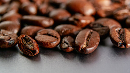 Roasted Coffee Beans on Dark Smooth Surface