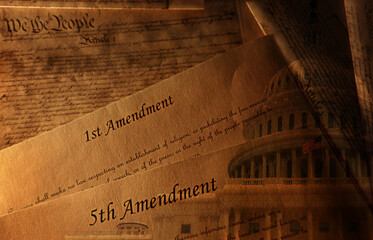 Fototapeta premium The First and Fifth Amendments of the US Constitution and the Capitol Building in Washington DC