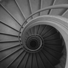 Spiral staircase viewed from above, black and white architectural detail, modern design