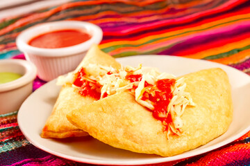 Fried empanada filled with meat and vegetables.
